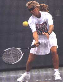 Woman hitting forehand